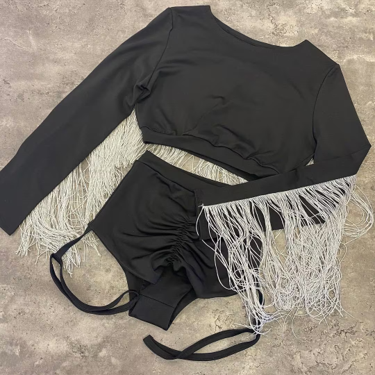 Black and silver costume with fringes