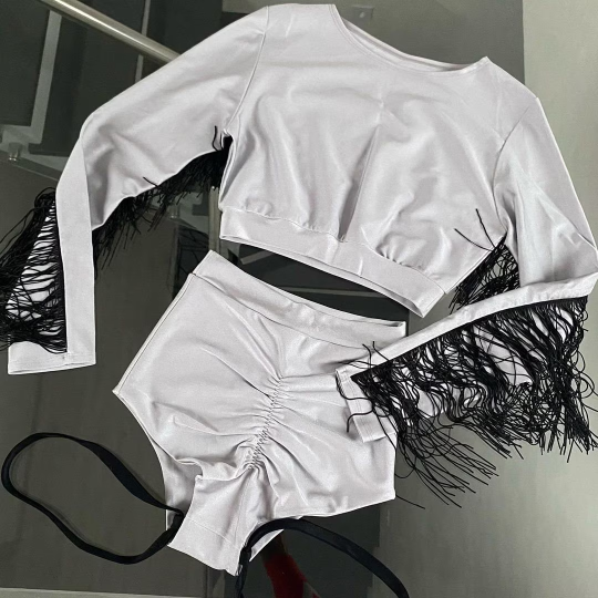 Silver and black costume with fringes