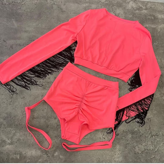 Orange and black outfit with fringes