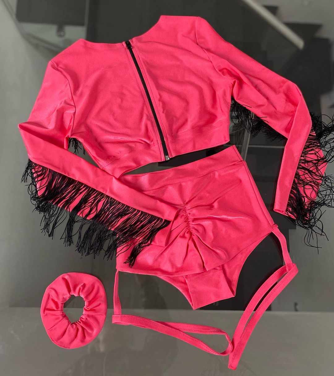 Neon yellow costume with fringes on zippered top