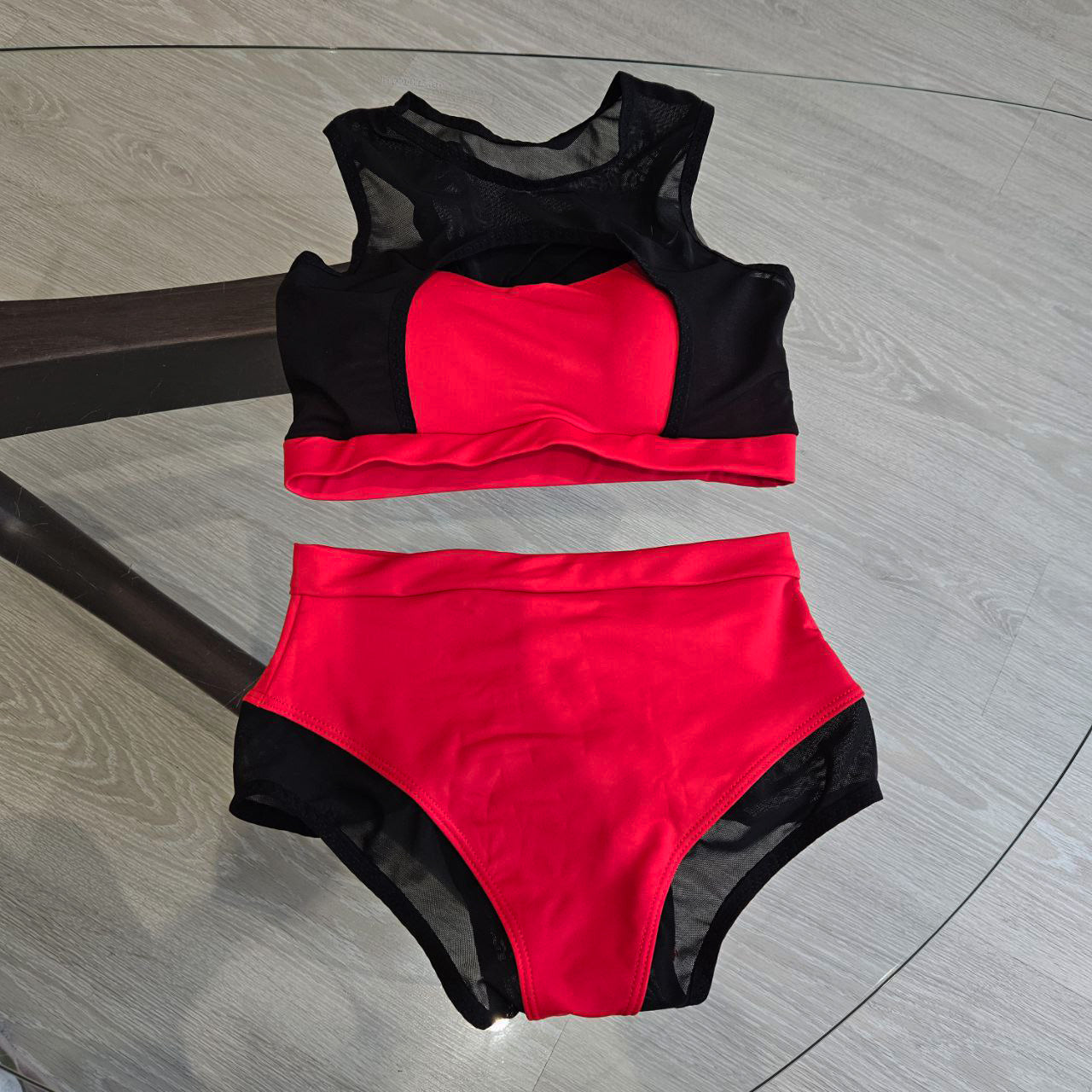 Pole dance costume with black translucent inserts on the top and bottom